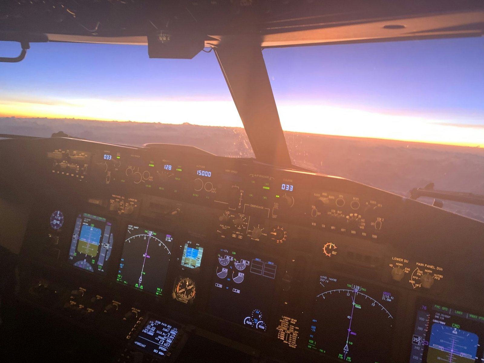 Airliner cockpit at sunset